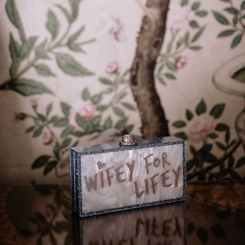 Glitter with pearlised background clutch reading 'wifey for lifey' bridal bag 