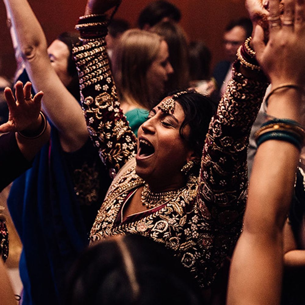 Guest in Indian saree dancing to music for weddings