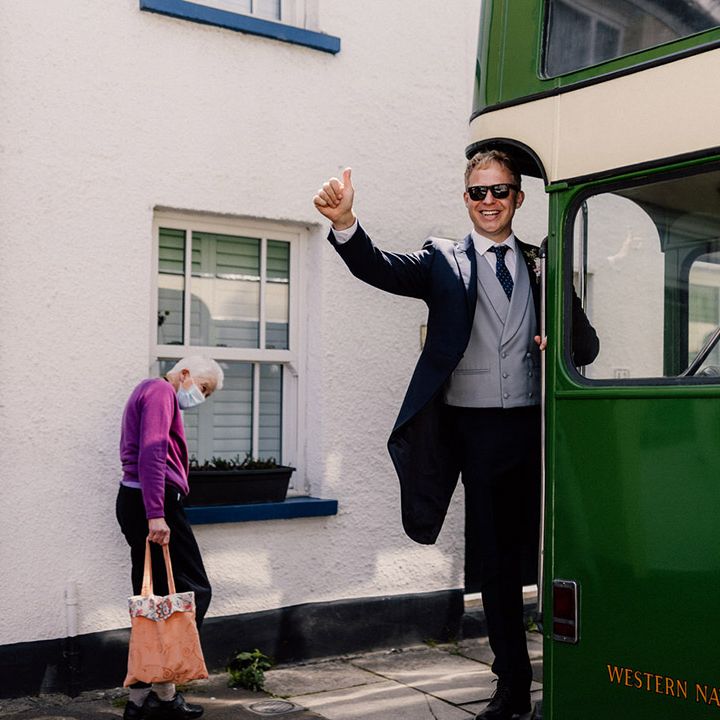 Vintage green bus wedding transportation carrying guests over to the wedding reception 