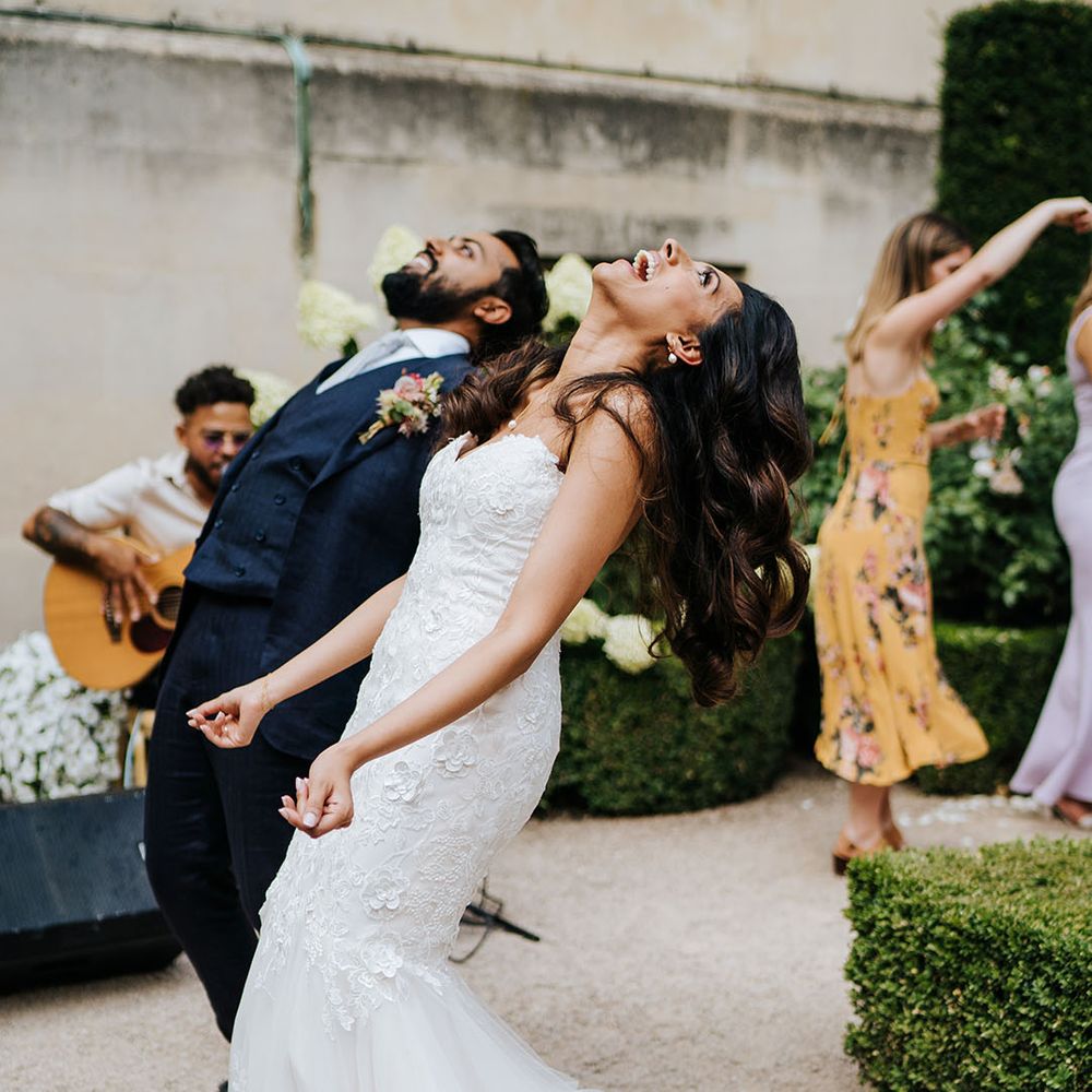Bride & groom dance outdoors at Syon Park before wedding reception 
