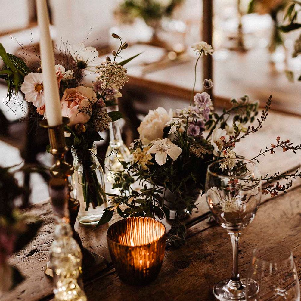 Earthy, neutral themed wedding tablescape with glass decor at Treseren, Cornwall