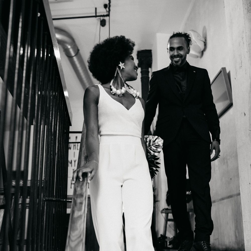 Bride & groom walking down the stairs 