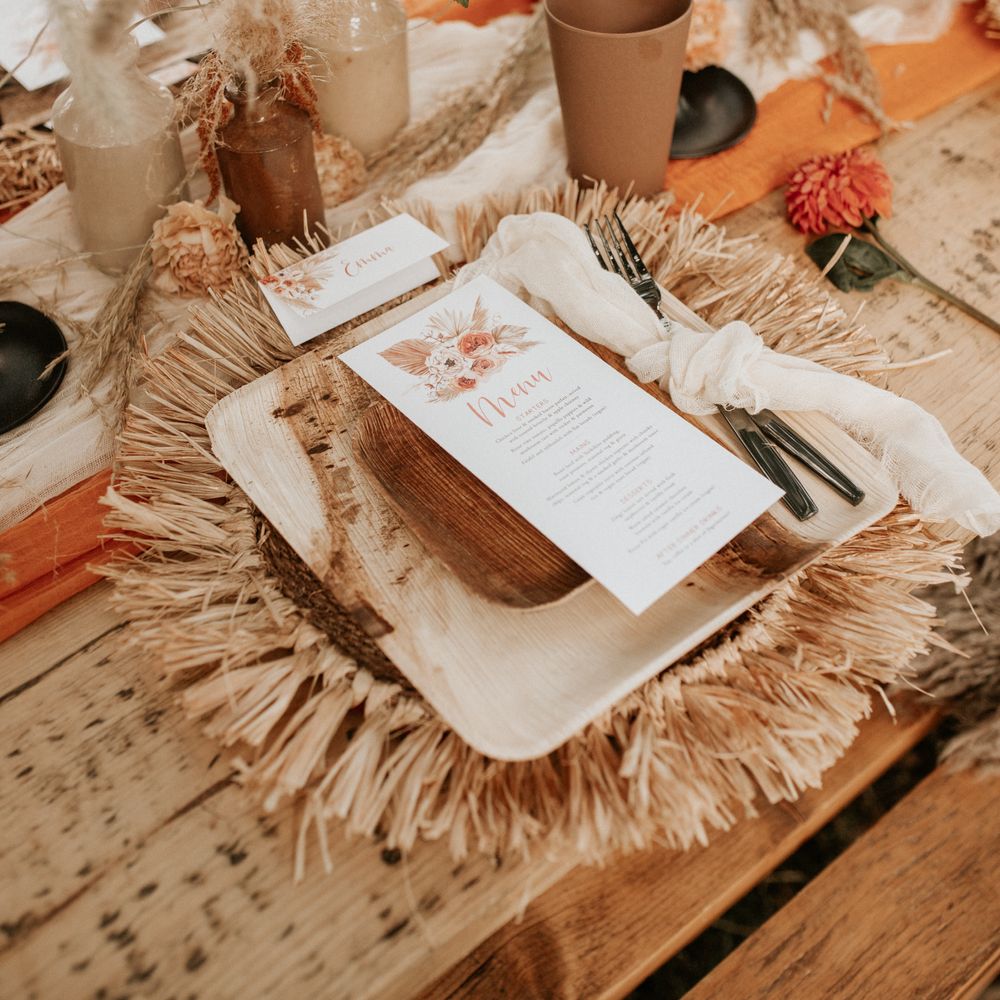 Wooden plates on straw placemats 