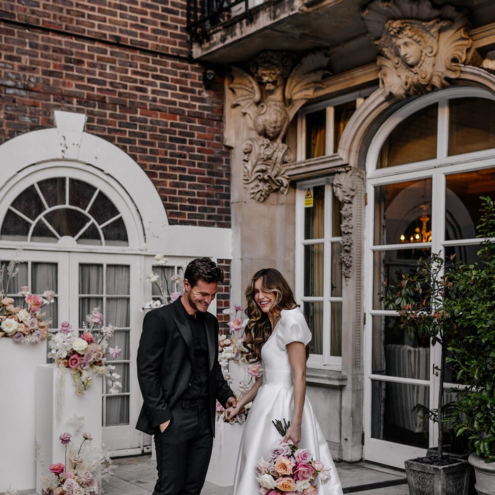 Intimate outdoor wedding ceremony at Dartmouth House weddings venue in Mayfair with blush wedding flowers 