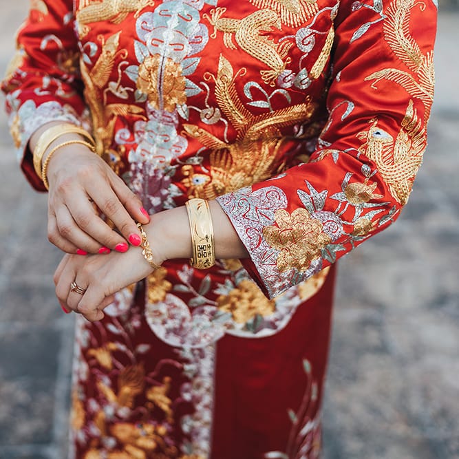 Bride wears traditional Chinese outfit on her wedding day for Chinese Tea ceremony