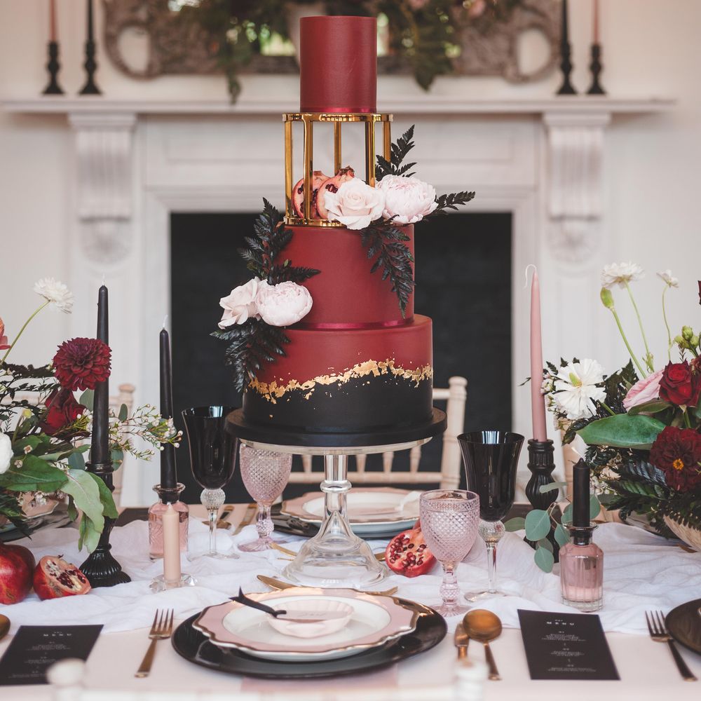 Three tier deep burgundy, black and gold elegant wedding cake for Pomegranate Noir autism marriage wedding inspiration 