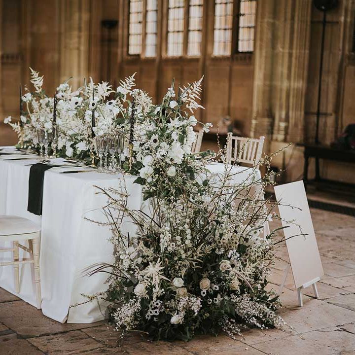 White and green wedding flower arrangement with roses, anemones and astilbe 