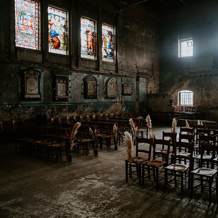 Pampas grass lines the aisle at unique London wedding venue, The Asylum Chapel