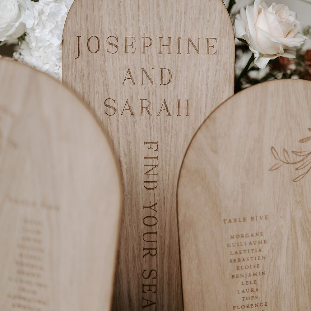 Light wood arched wedding table plan 