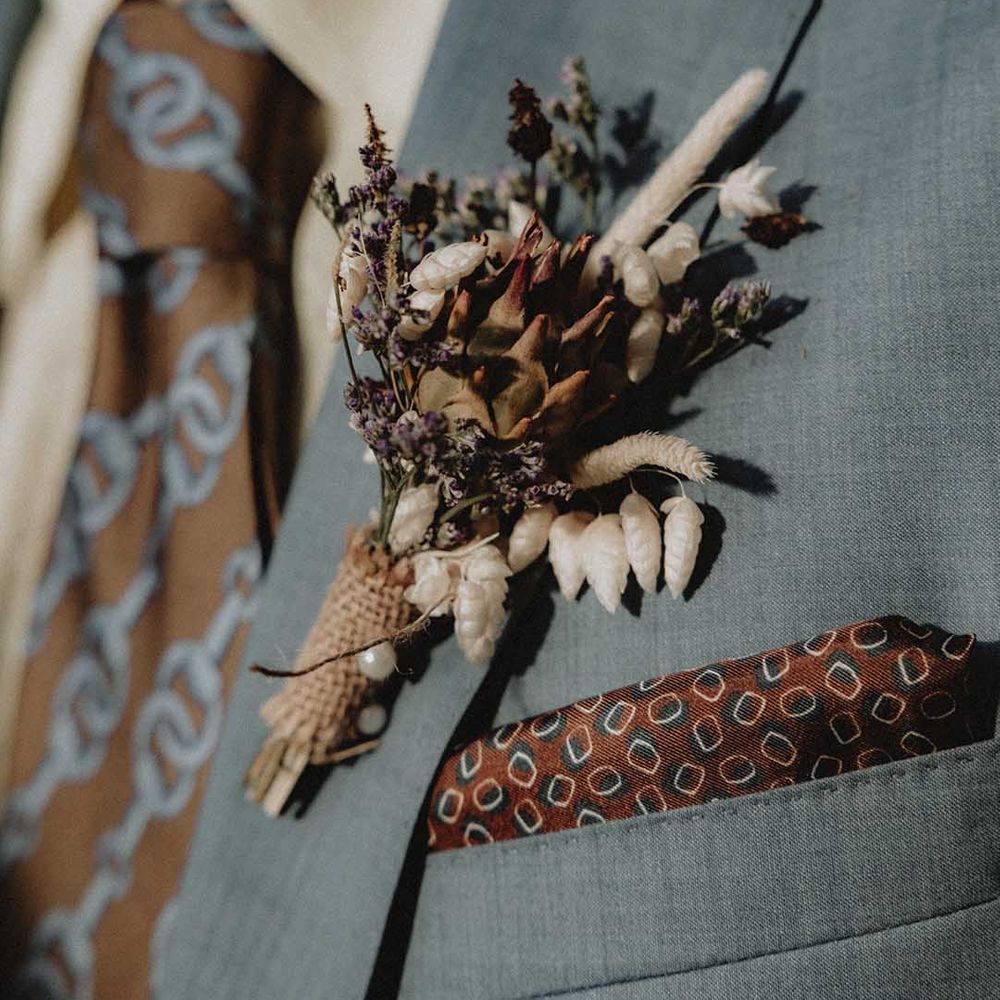 DIY wildflower buttonhole in powder blue Gucci suit 