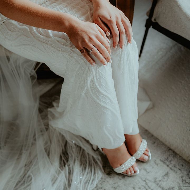 Bride in patterned sequin wedding dress form Made With Love with pearl wedding shoes 