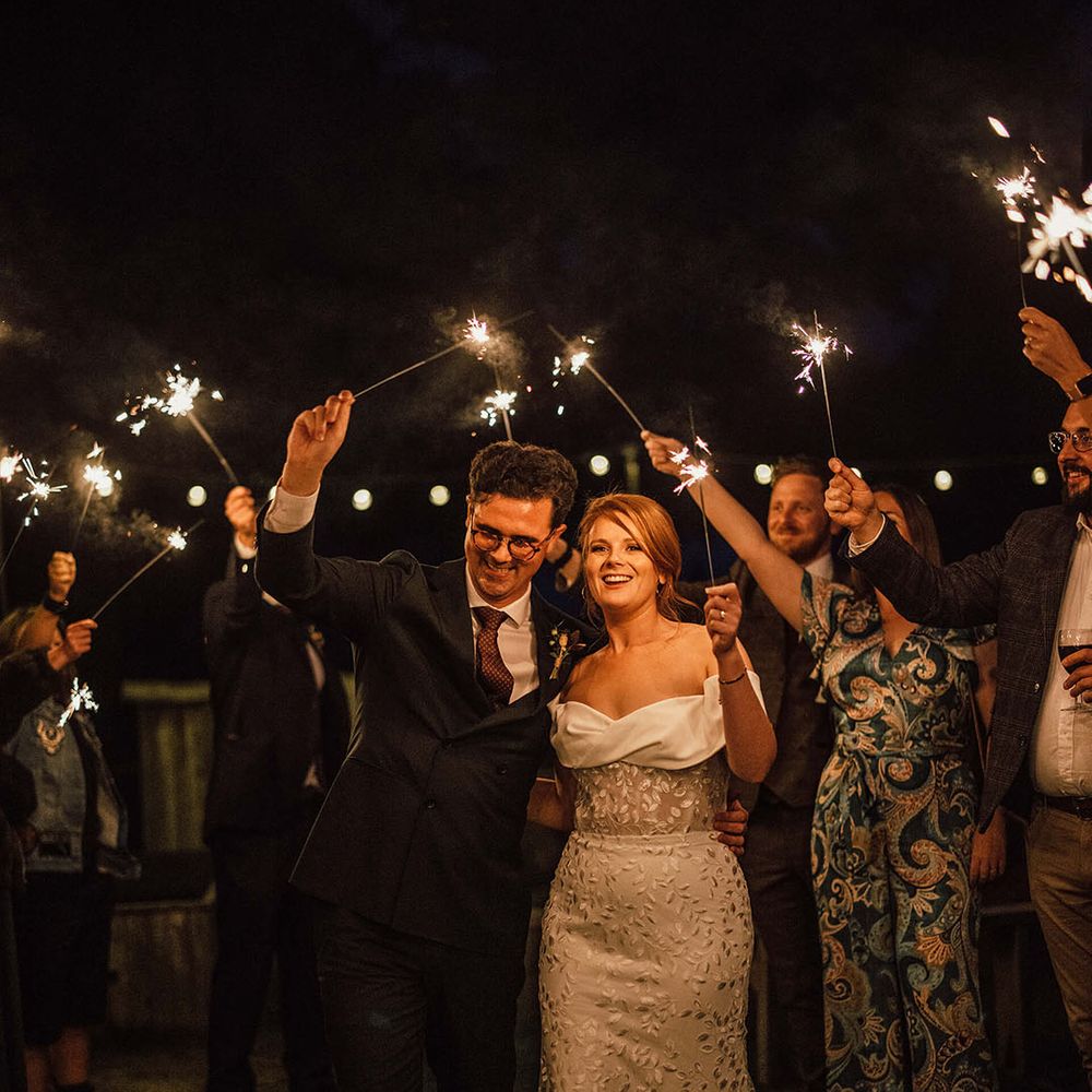 Bride & groom walk through sparkler exit 
