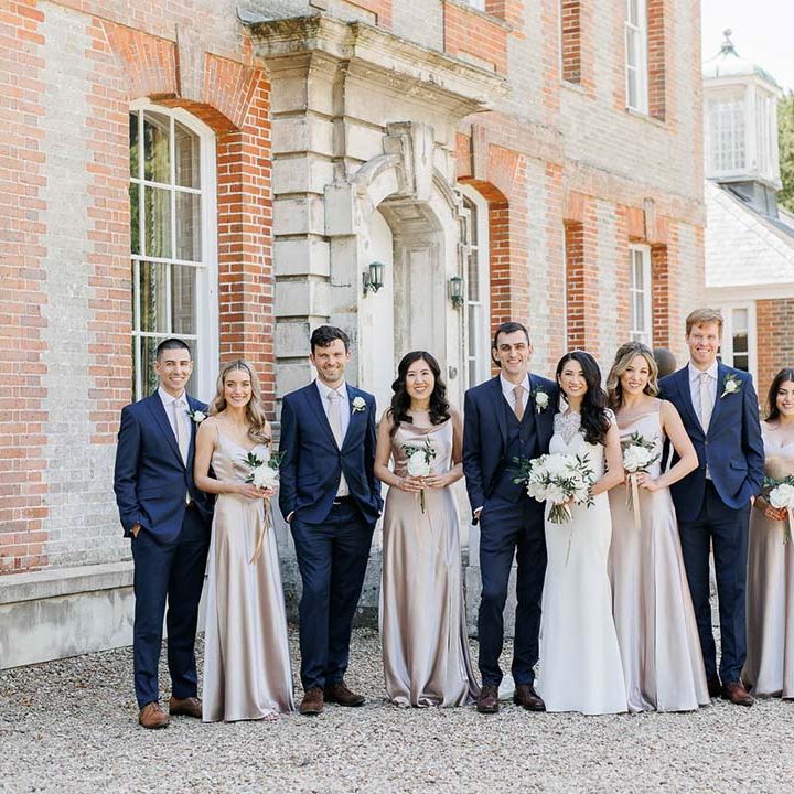 pink bridesmaid dresses and navy groomsmen suits wedding party outfits 
