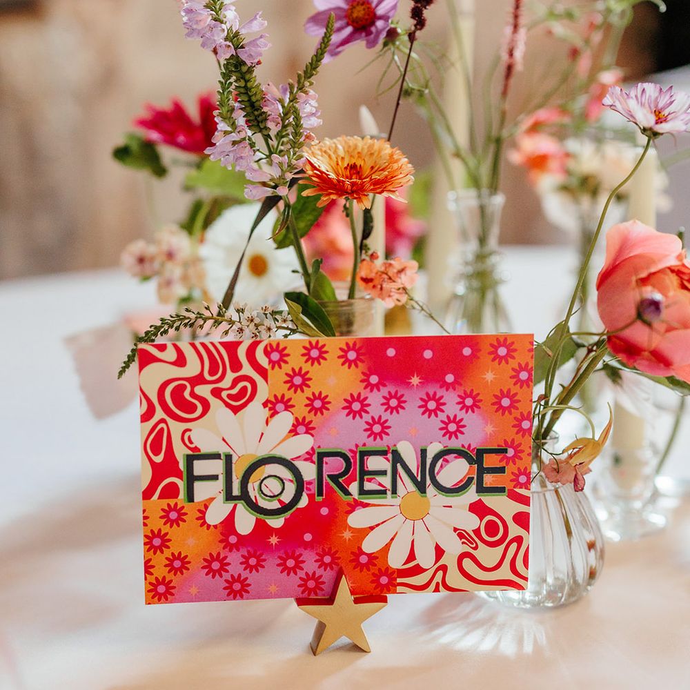 Bright and funky pattered table name sign 