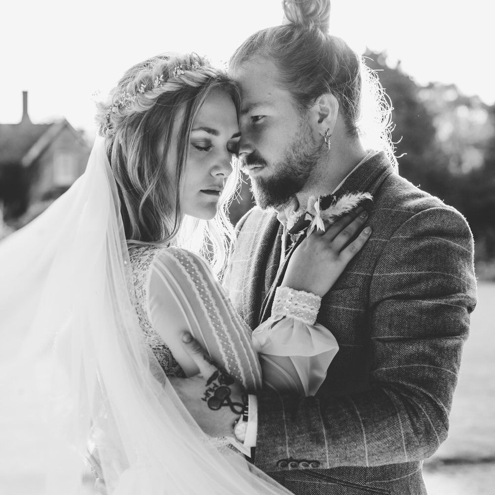 Dramatic black and white wedding photography close up of bride and groom 