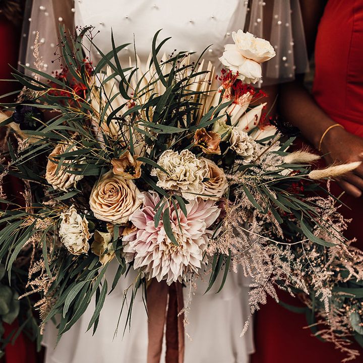 Oversized wedding bouquet with dried and fresh flowers I dusky pinks, beiges and green foliage. 