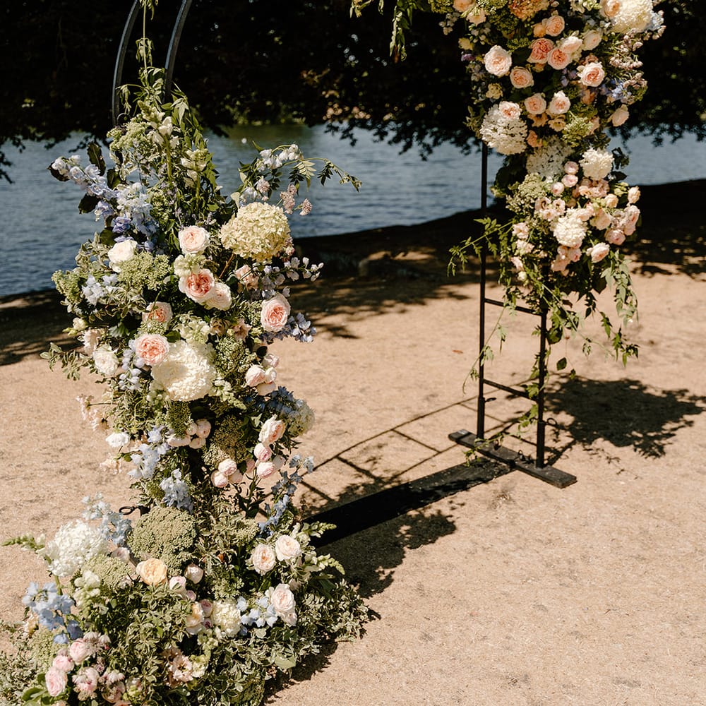 Black steel arch complete with floral decor by the River Thames