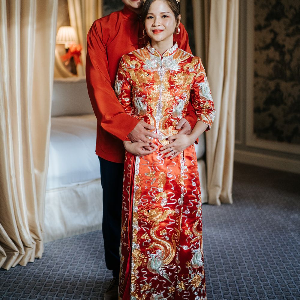 Groom embraces his bride during Chinese Tea Ceremony at The Dorchester on their wedding day
