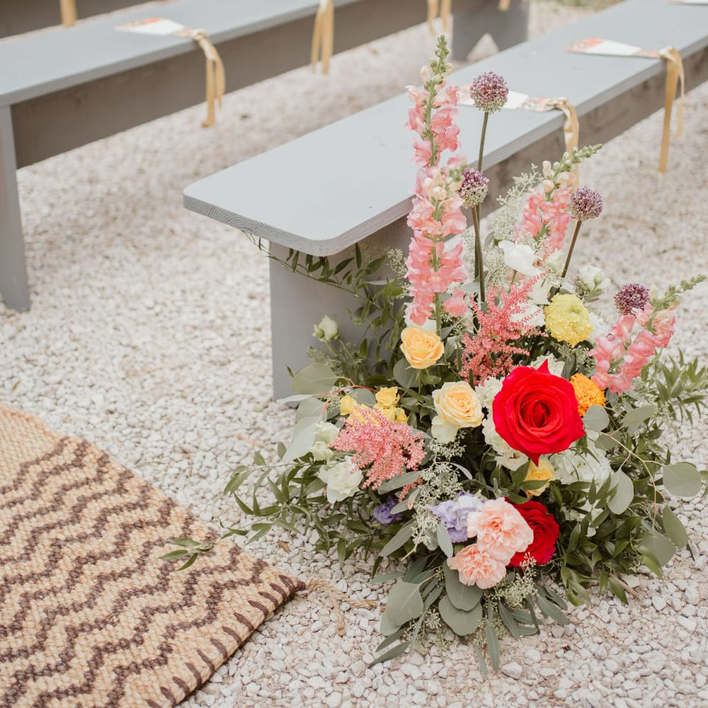 colourful aisle wedding flowers at outdoor Domaine de Blanche Fleur, Provence wedding 