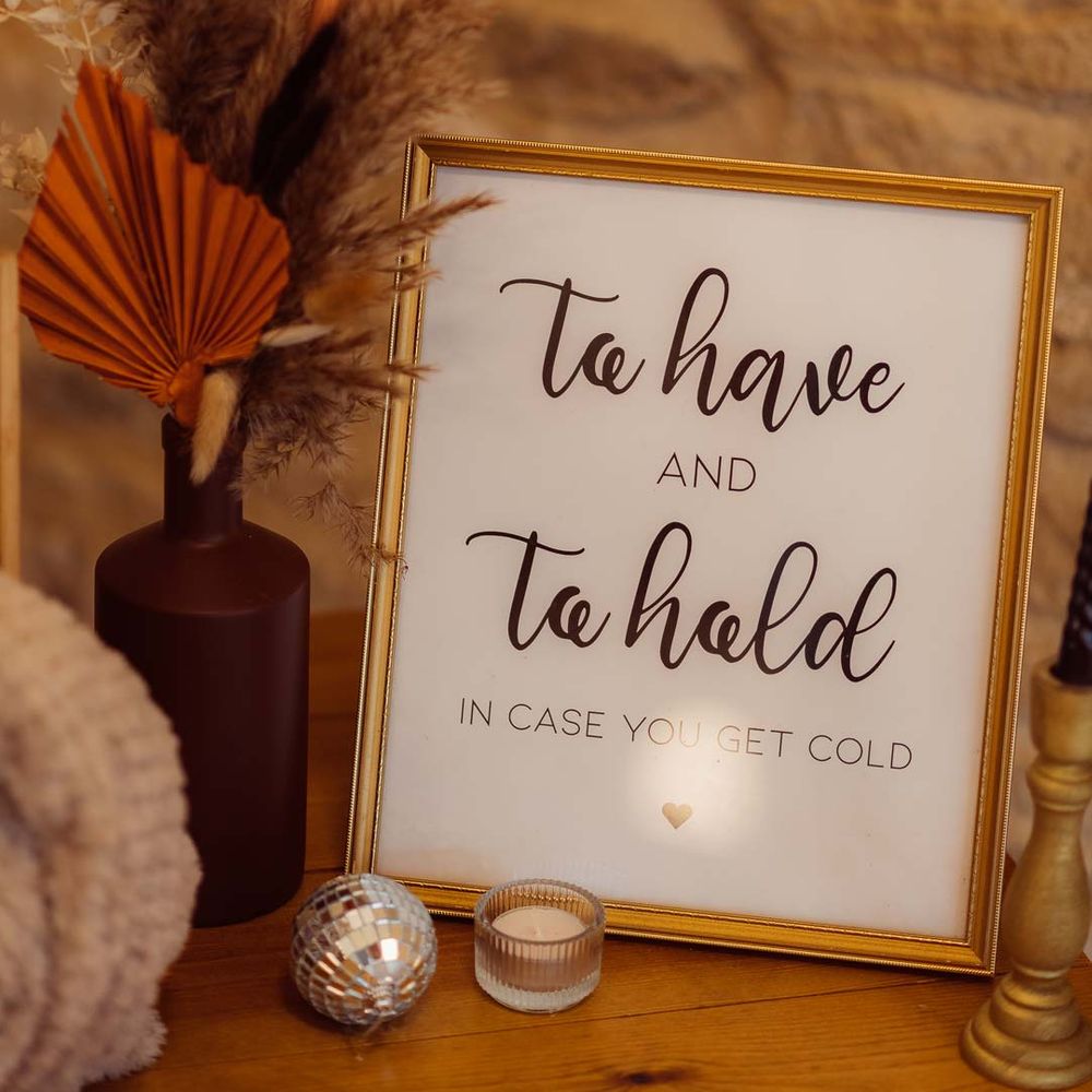Minimalist white wedding sign in gold frame with pampas grass wedding flower arrangements and disco ball wedding decorations