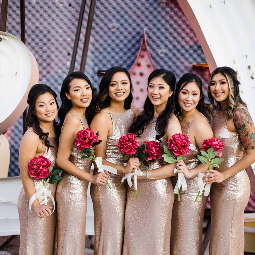 Bridesmaids wearing strappy gold sequin bridesmaid dresses - hen party ideas