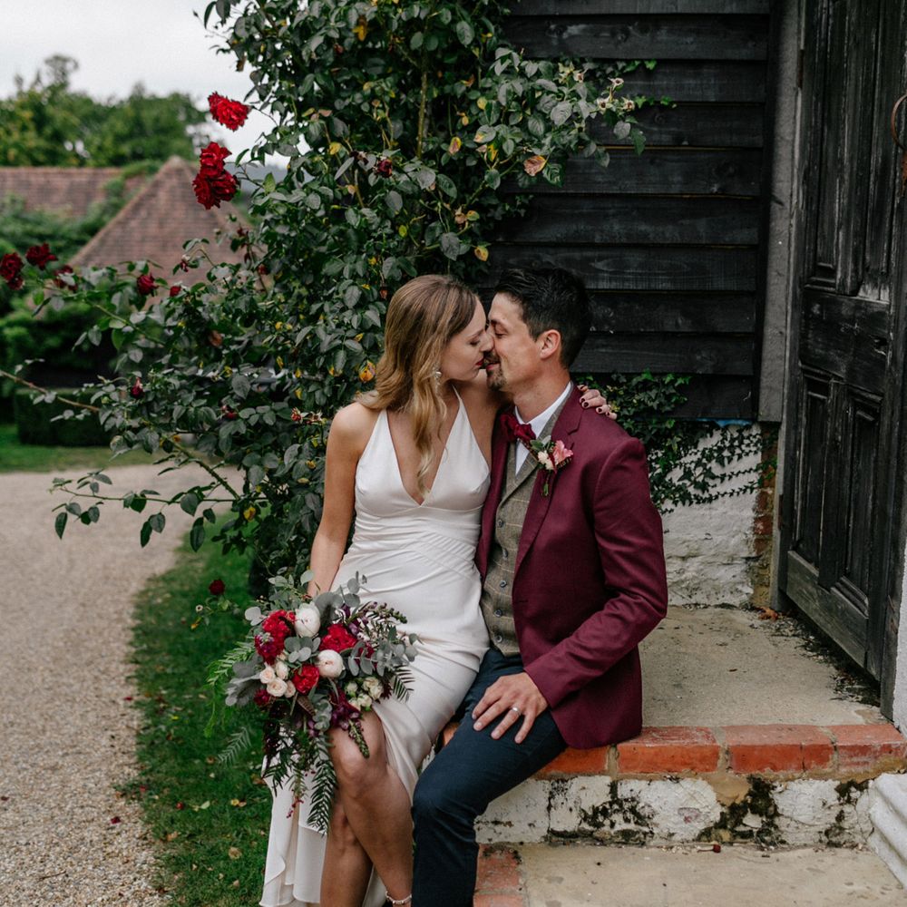 Bride and groom kissing at High Billinghurst Farm wedding