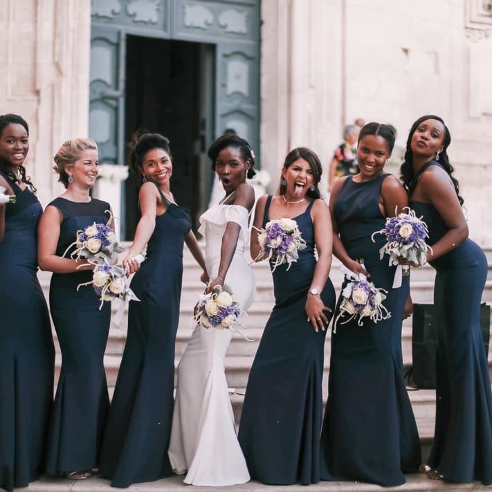 Fun bridal party photography with bridesmaids wearing midnight blue bridesmaid dresses 