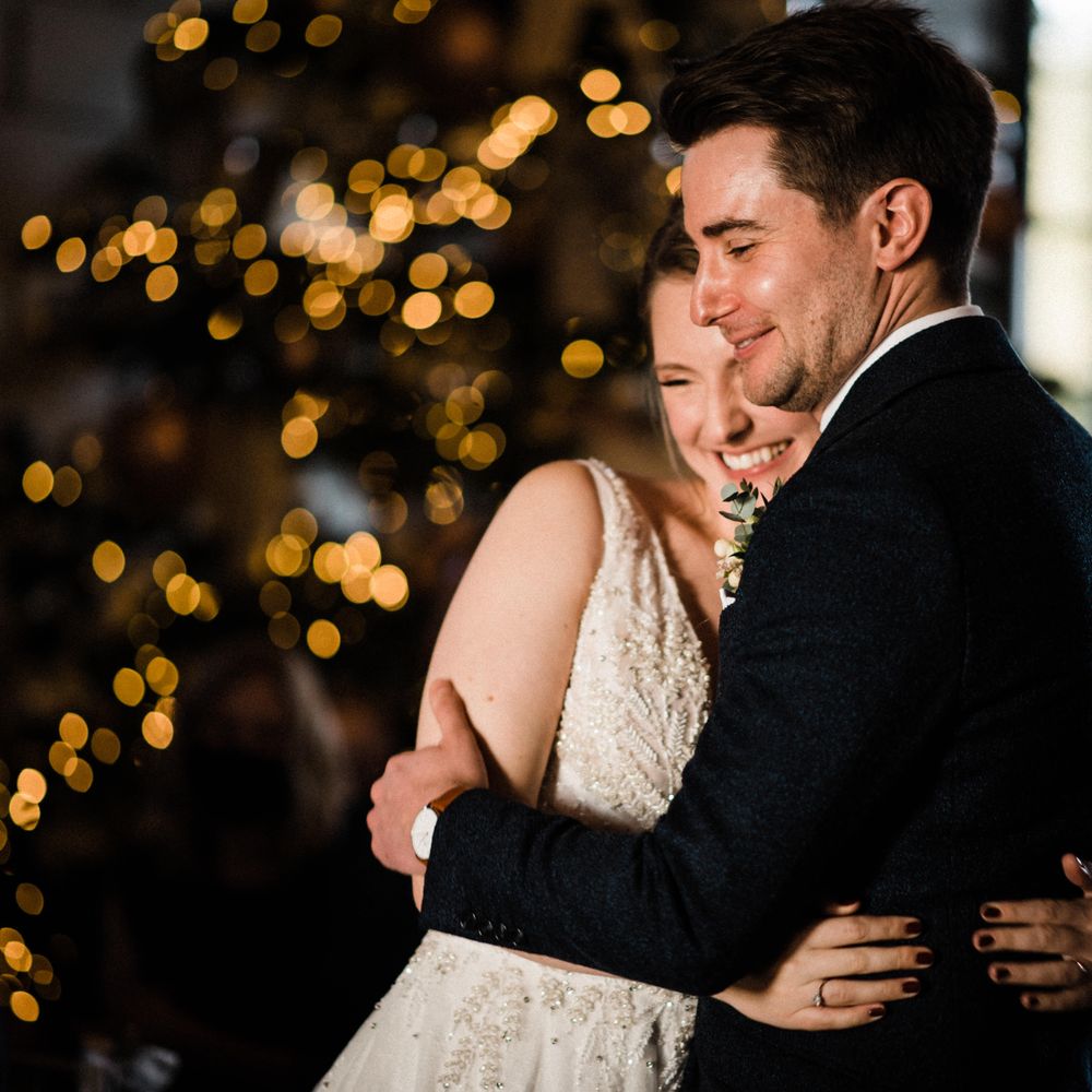 Bride & groom kiss during their wedding ceremony