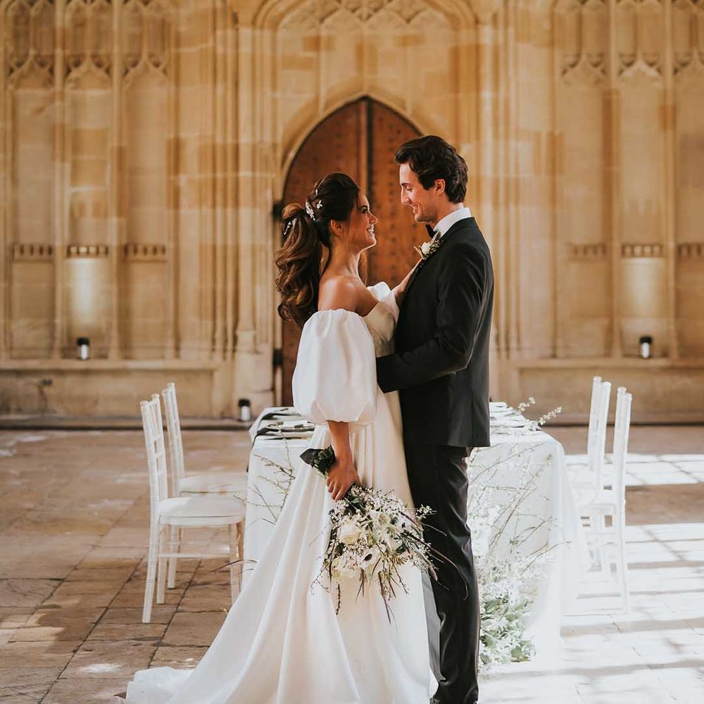 Sophisticated black tie wedding at Bodleian Library in Oxford with bride in a Nortier Shallow with a stylish ponytail up do 