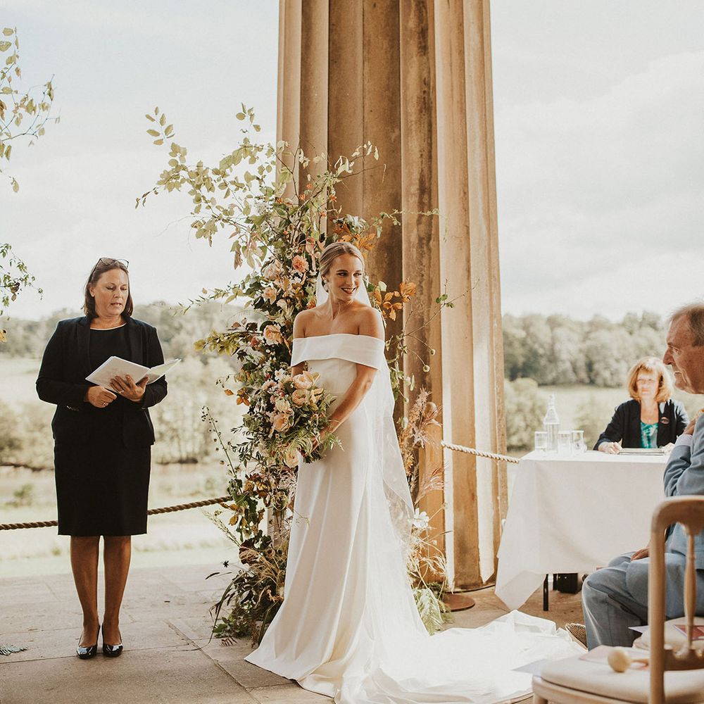 Bride looks to her side on her wedding day during ceremony