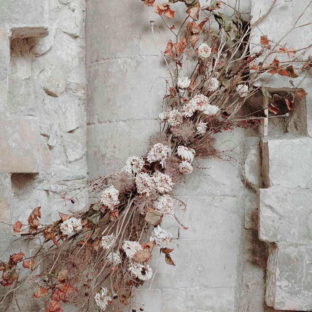 Dried flowers, twigs and foliage wedding flower arrangement at gothic wedding inspiration 