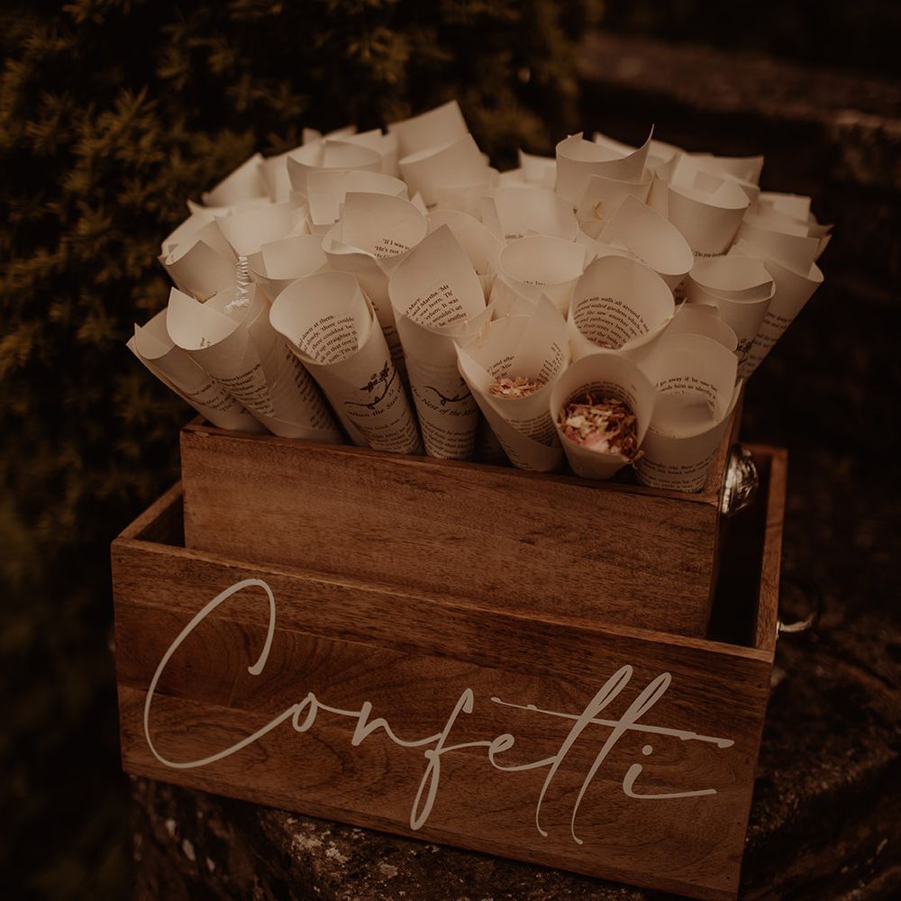 vintage book page confetti cones in a wooden box