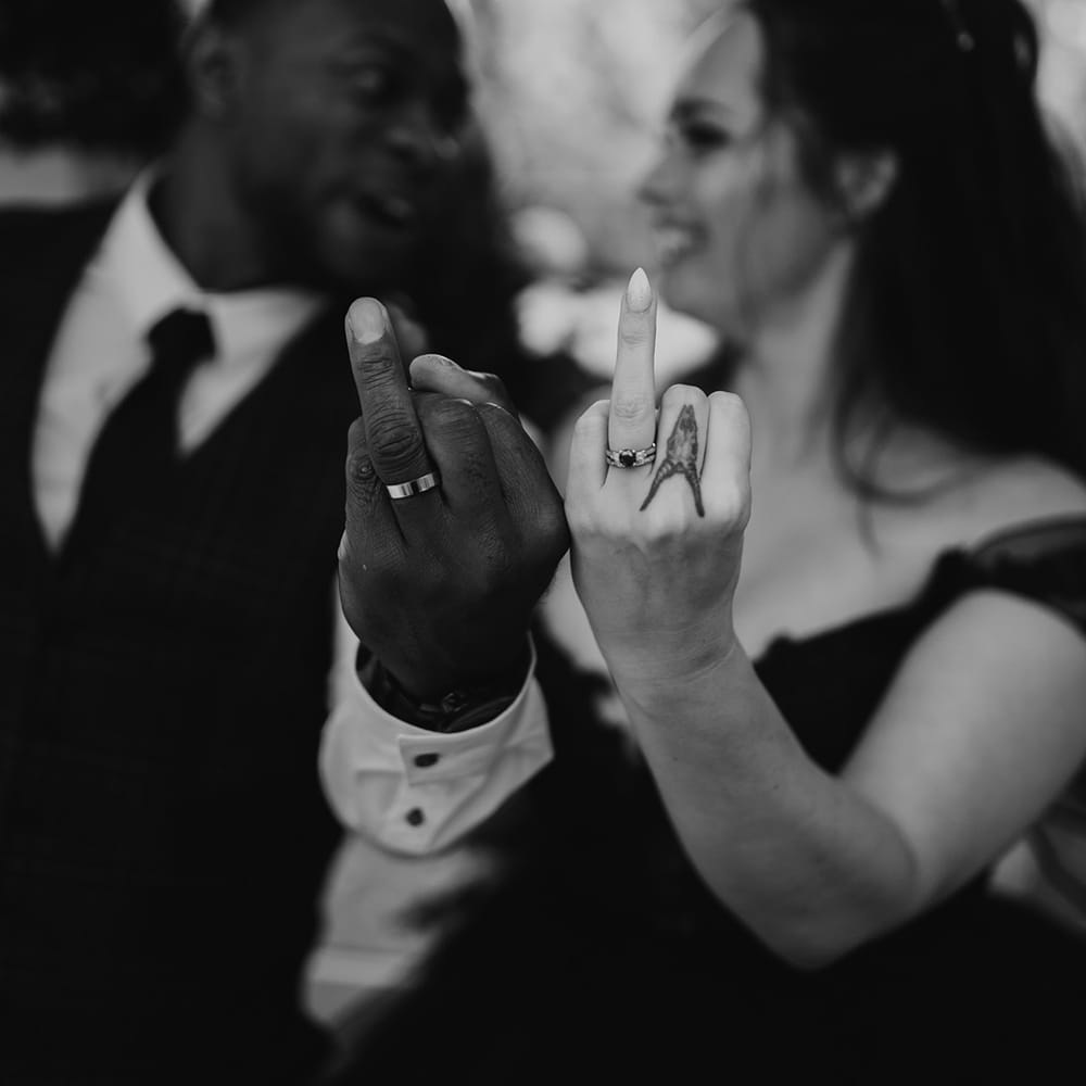 Bride & groom show off wedding rings after ceremony