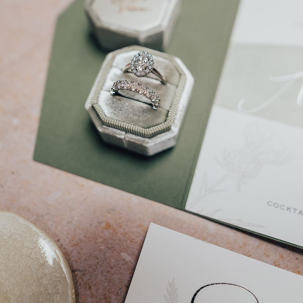 Diamond engagement ring and wedding band in a velvet ring box 