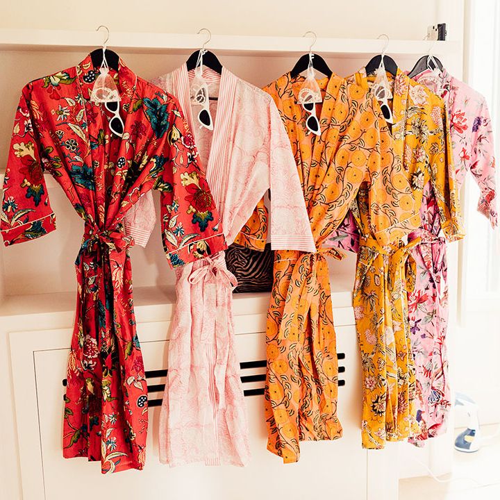 Colourful patterned bridesmaid robes with white cat eye sunglasses and jewellery 