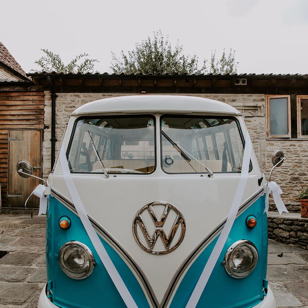 VW camper van in white and blue complete with white ribbon 