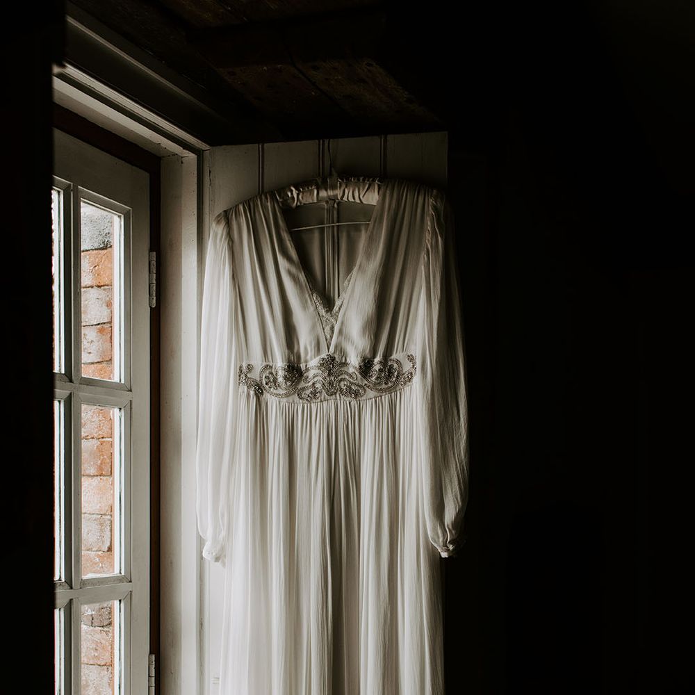 eBay wedding dress with full sleeves and boho styling complete with embellished waistband 