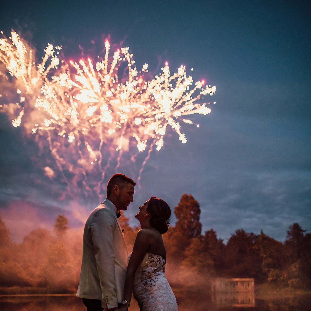 The bride and groom watch their surprise fireworks 