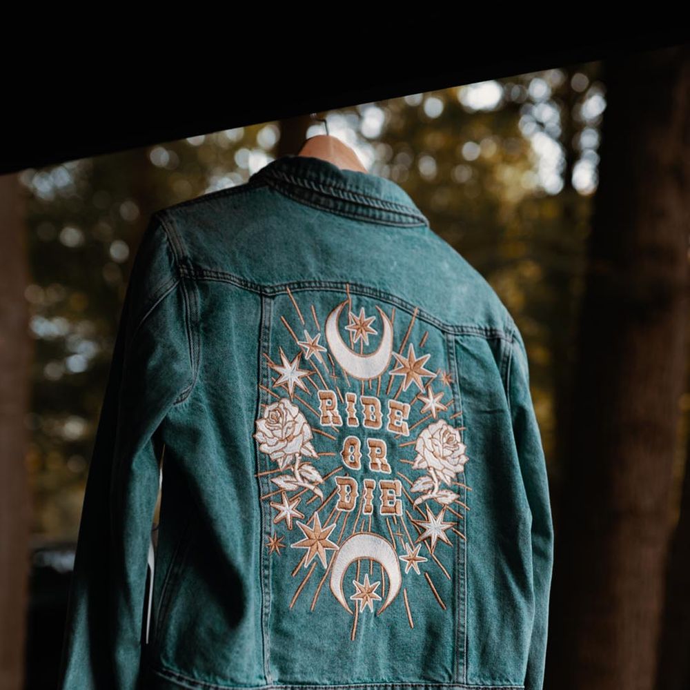 Embroidered custom wedding denim jacket cover-up with moon and rose designs 