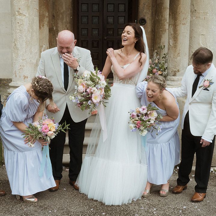 Wedding party in blue and cream wedding outfits for the spring April wedding 