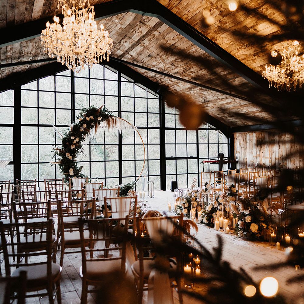 Chandelier and candle lit wedding venue at the Lake District for winter wedding with moongate