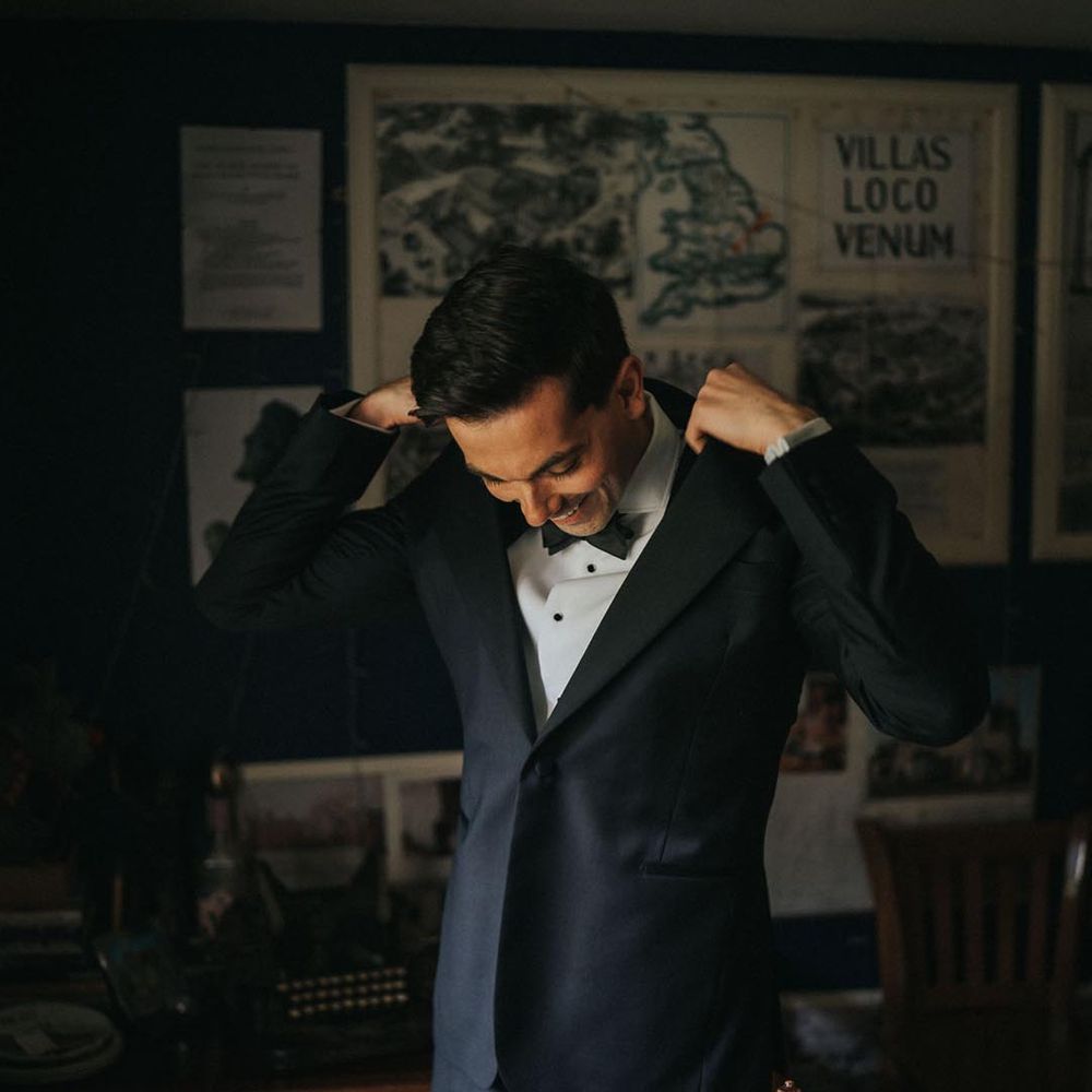 Groom wearing classic and traditional black tie for his luxe wedding at Stowe House