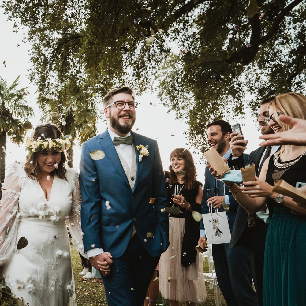 Confetti moment as the couple descend up the aisle as husband and wife 