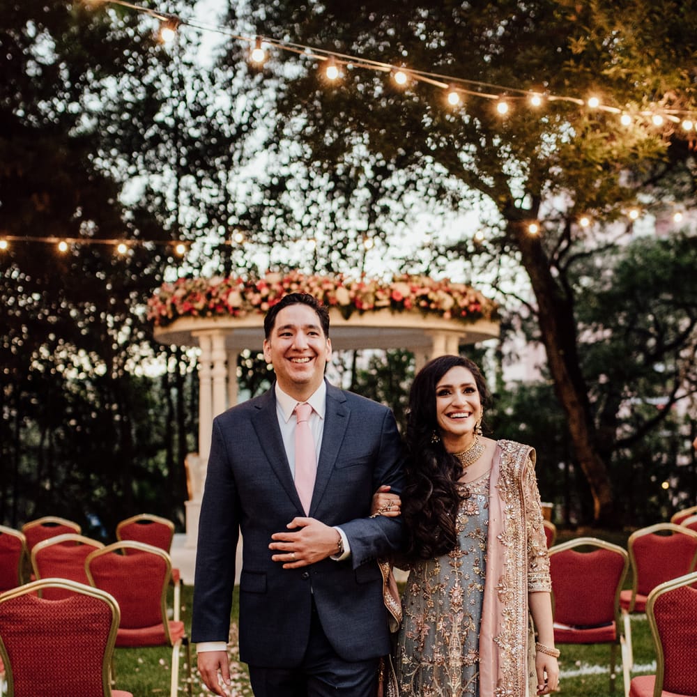 Bride & groom walk down the aisle with one another