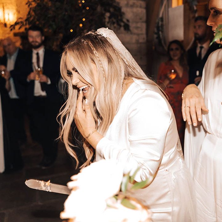 Bride tries wedding cake after cutting on her wedding day