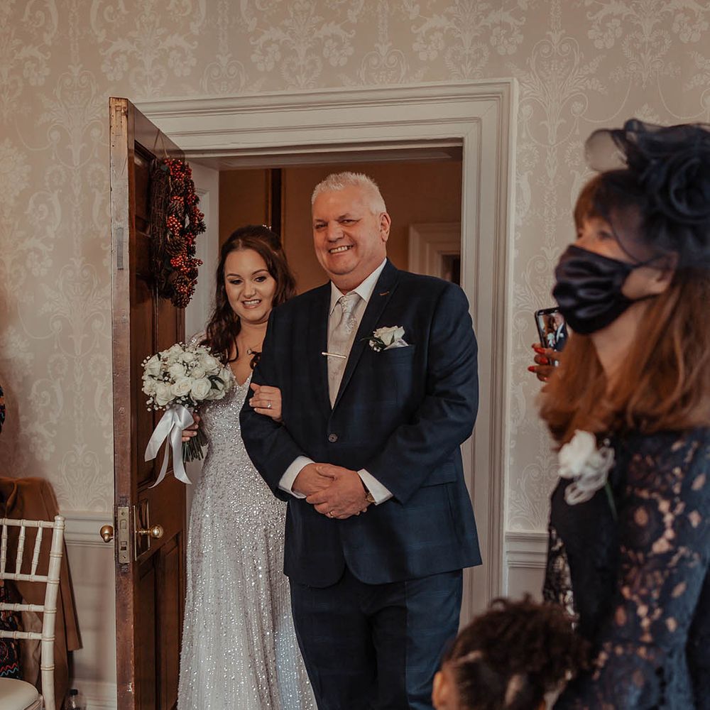 Bride walks down the aisle with her father