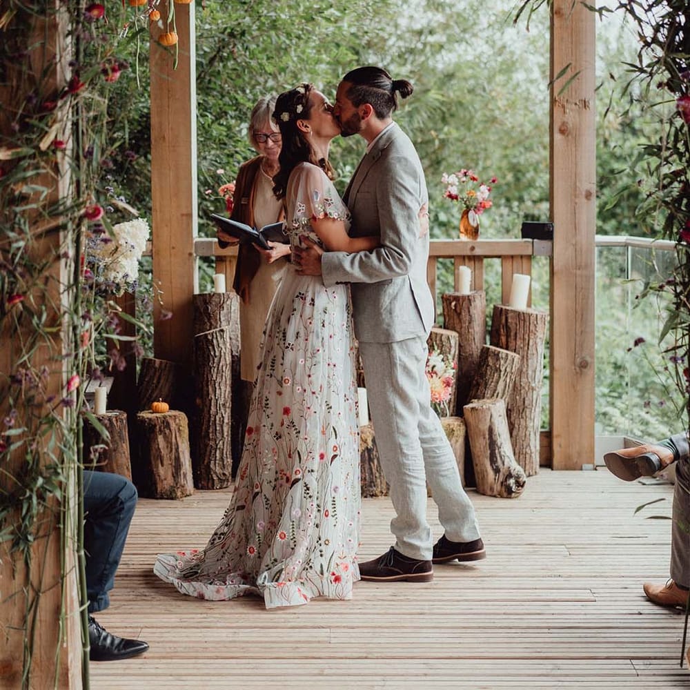 Bride and groom have their first kiss as a married couple 