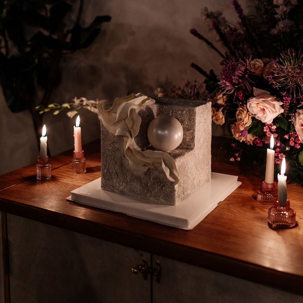 square concert wedding cake with intricate design at modern stylish London wedding 