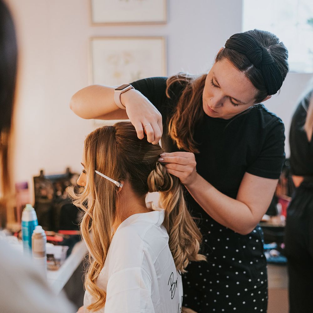 Bride gets her hair done for her wedding day 
