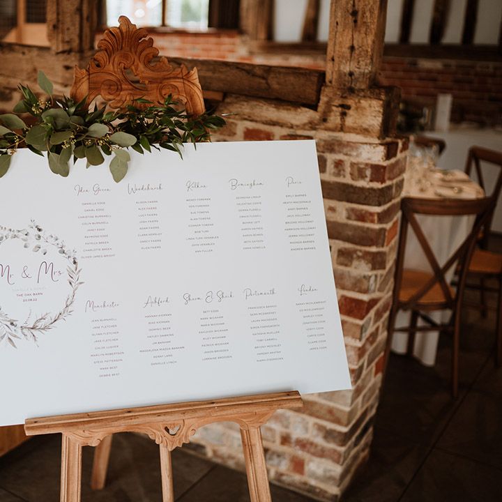 Simple and minimal wedding table plan with leaf design and decorative foliage 